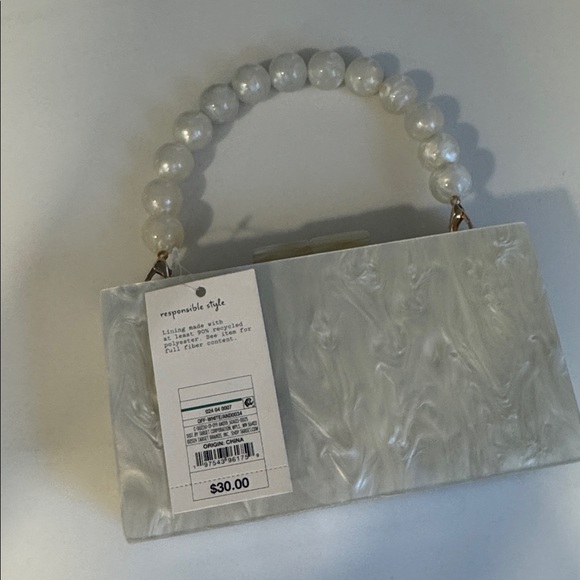 A New Day Pearl White Clutch with Beaded Handle
New with tags - Picture 2 of 3